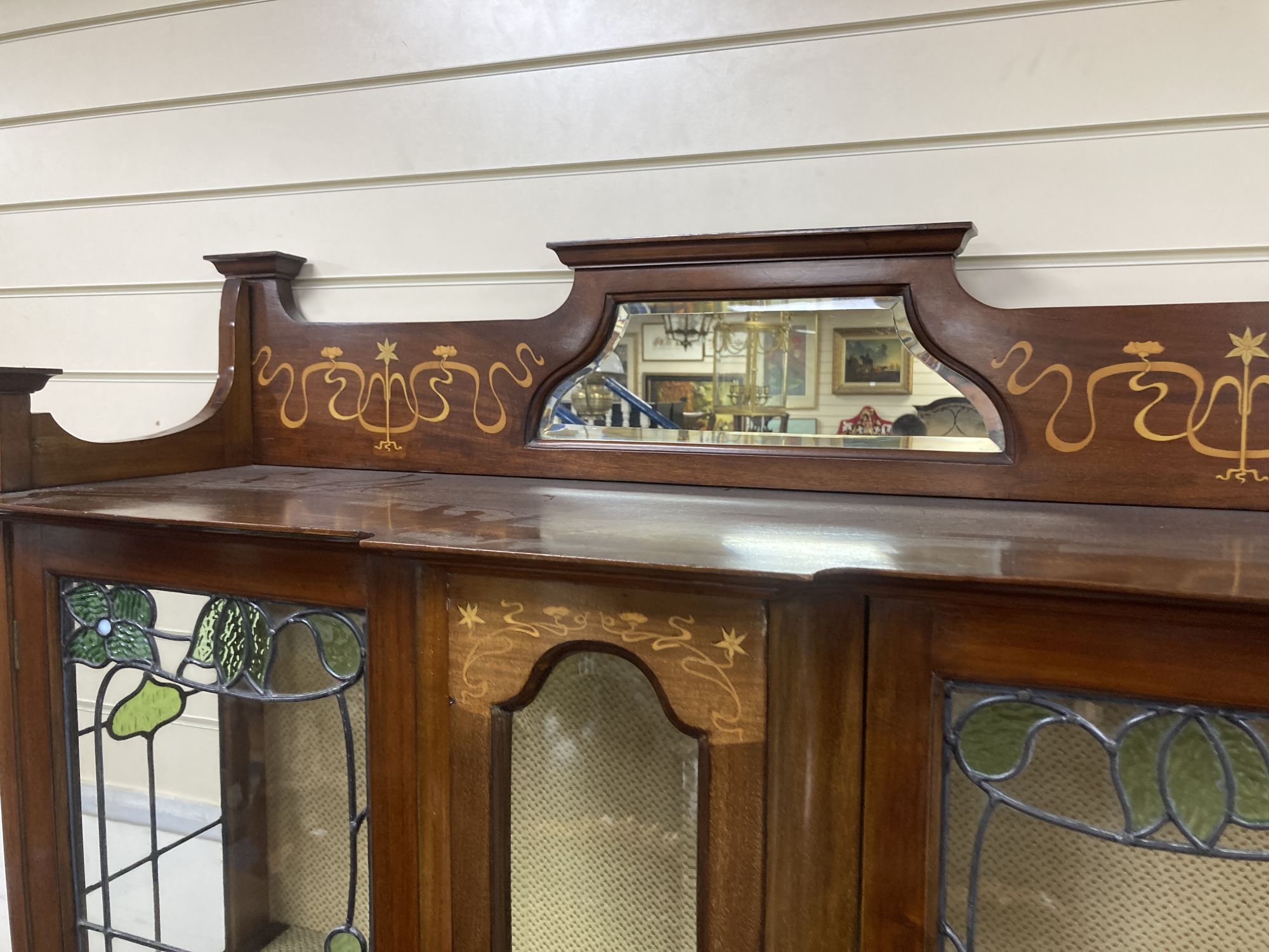 An Edwardian Art Nouveau marquetry inlaid mahogany display cabinet,